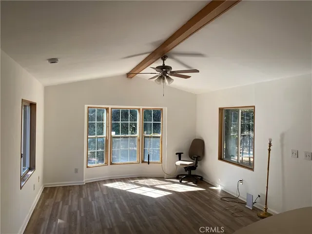 a room with bed closet and window