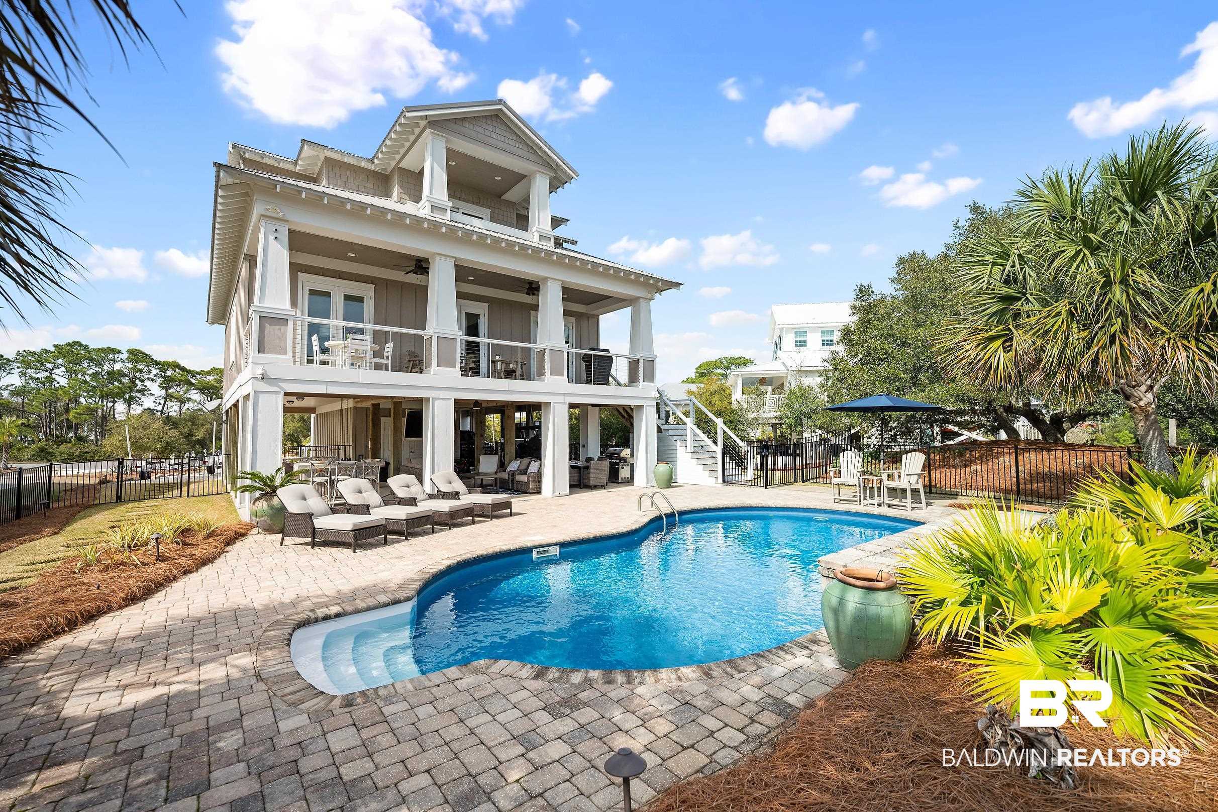 33186 Marlin Key Drive Orange Beach, AL 36561 - Photo 15 of 87 Rear view of property with a balcony, an outdoor lounge area, a patio area, a fenced backyard, and a ceiling fan