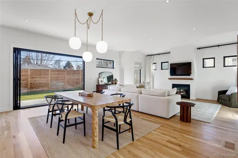 a living room with furniture flowerpot and window