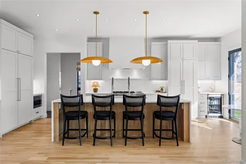 a kitchen with a dining table and chairs