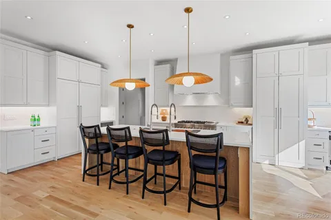 a view of a room with shelves and wooden floor