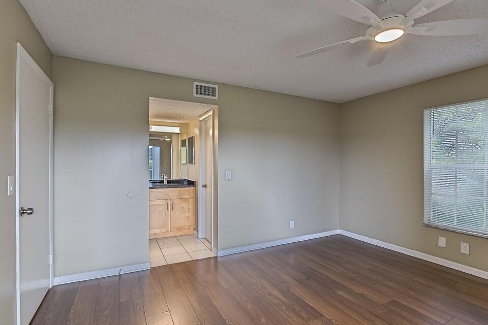 6284 La Costa Drive, Unit E Boca Raton, FL 33433 - Photo 13 of 24 Master bedroom