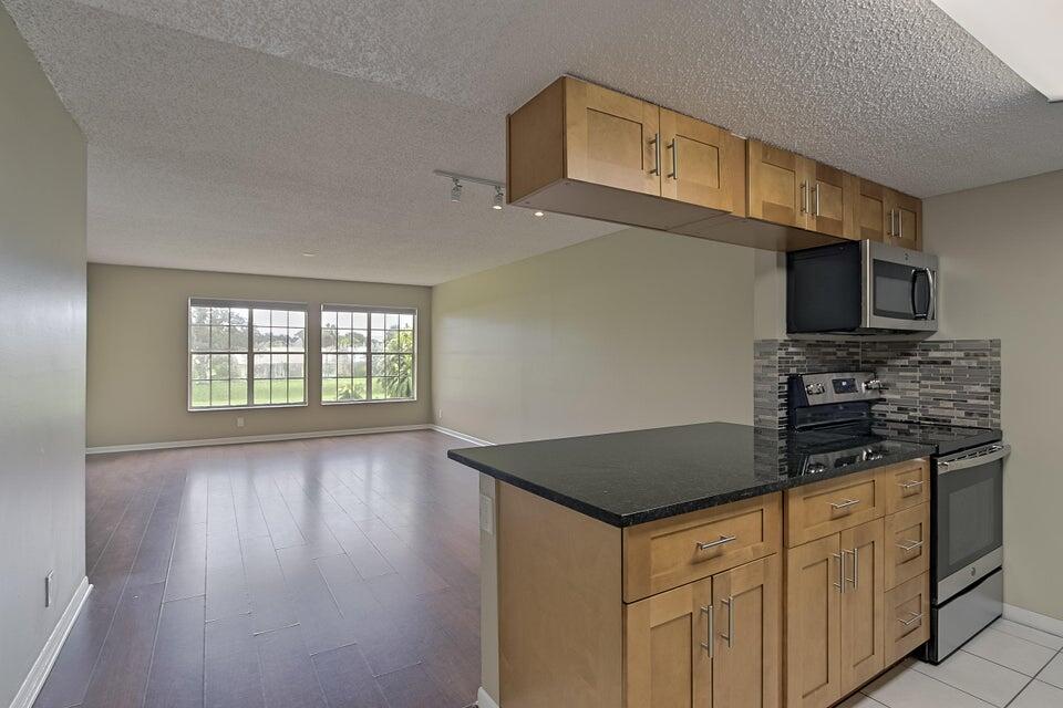 6284 La Costa Drive, Unit E Boca Raton, FL 33433 - Photo 6 of 24 Kitchen-Living