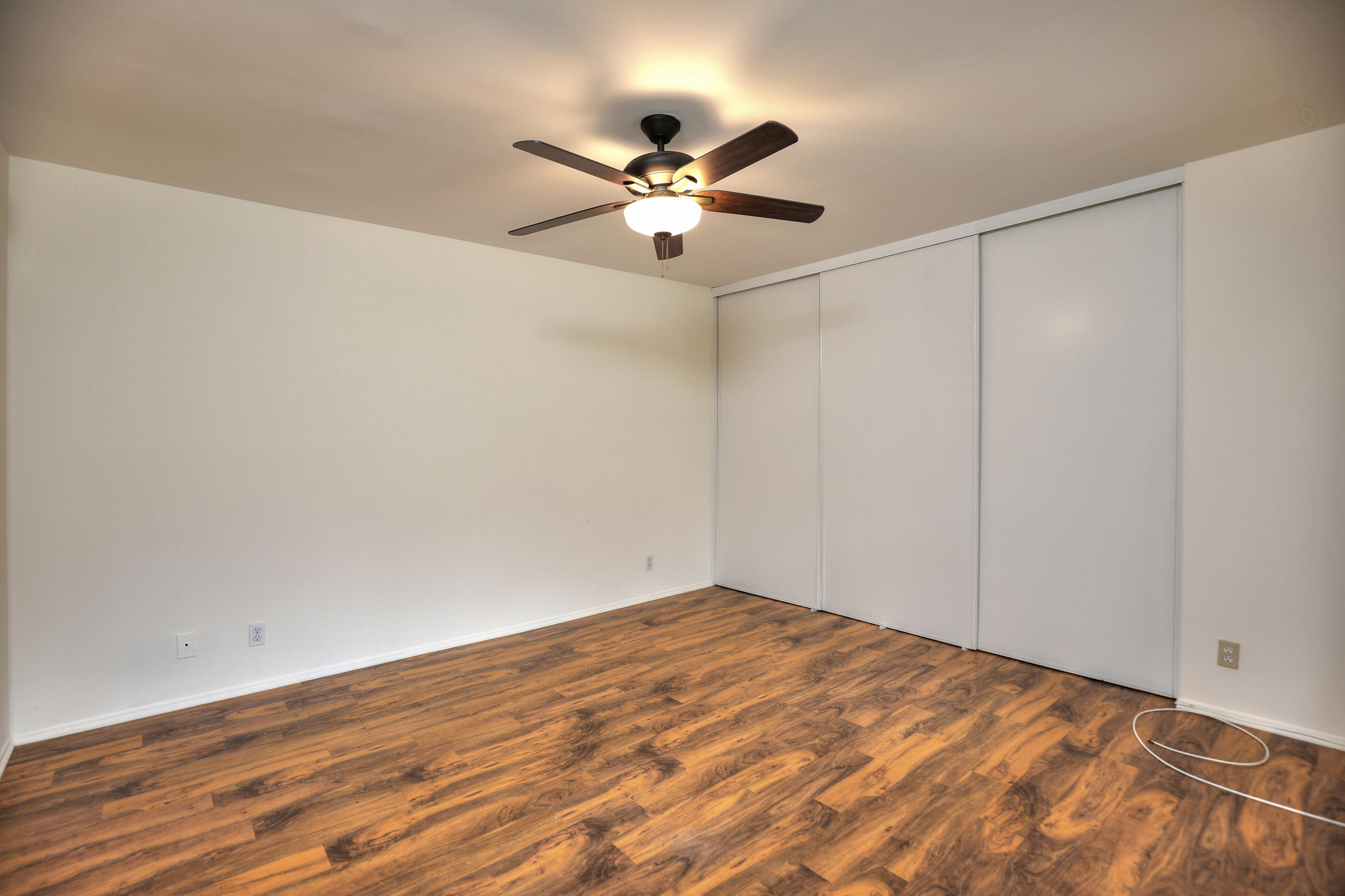 7320 Davenport Road Goleta, CA 93117 - Photo 13 of 18 a view of a room with a ceiling fan and wooden floor