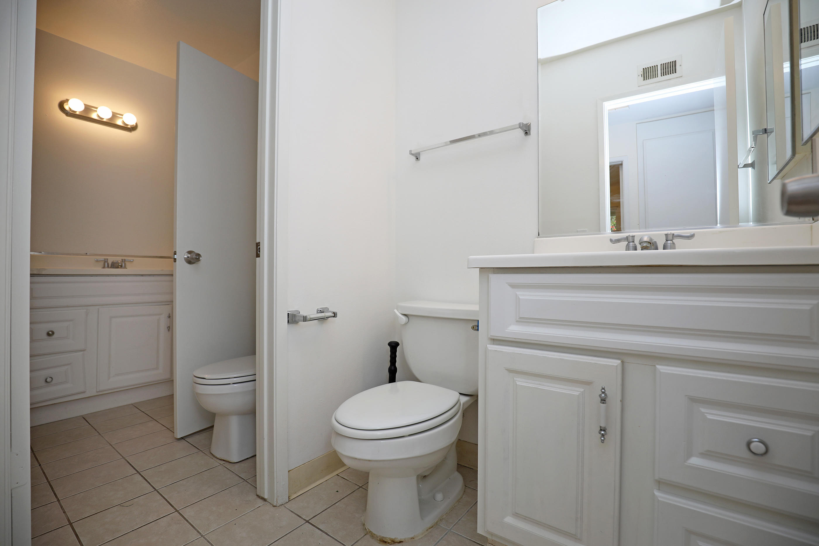 7320 Davenport Road Goleta, CA 93117 - Photo 16 of 18 a bathroom with a toilet a sink and mirror