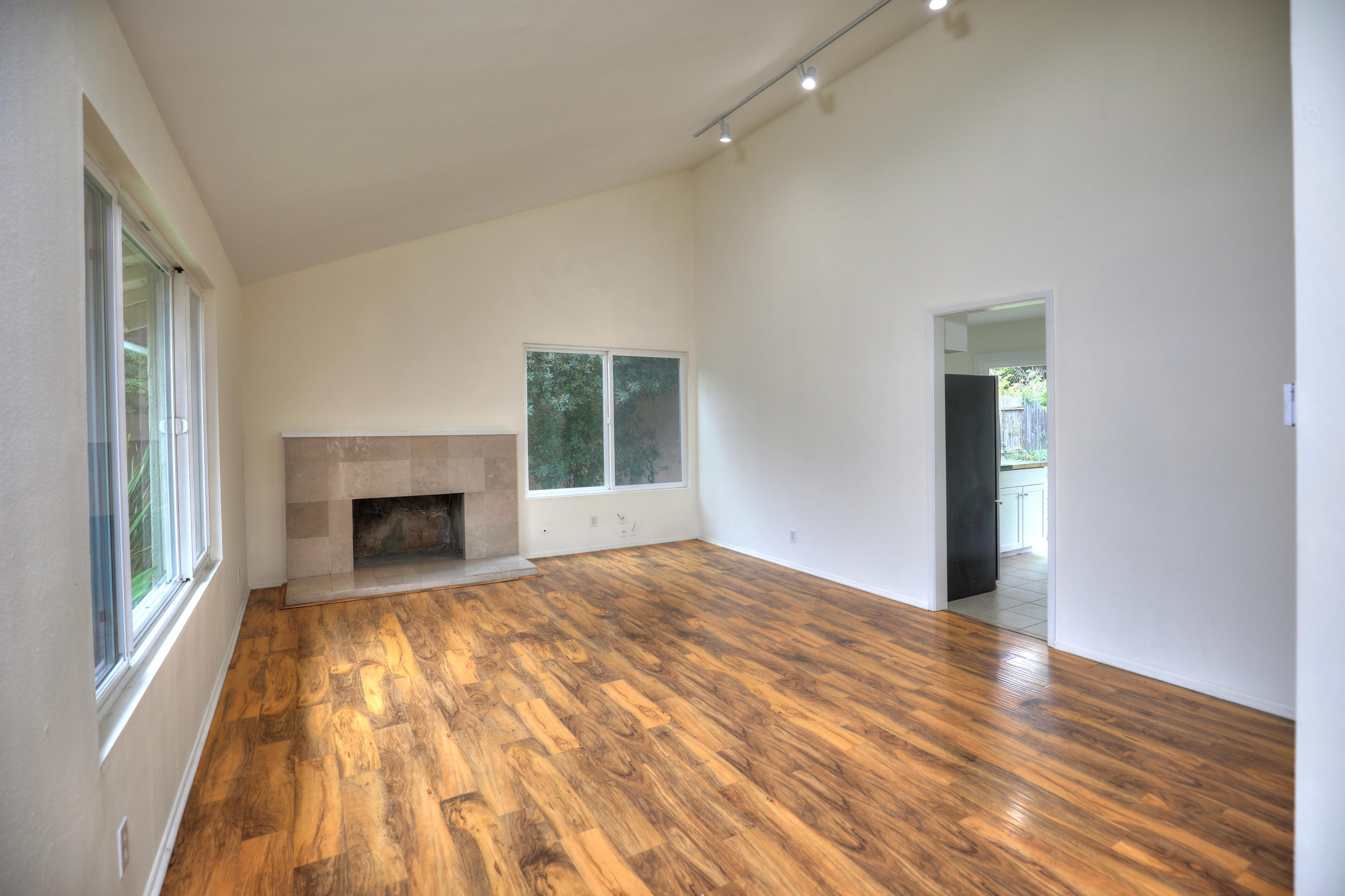 7320 Davenport Road Goleta, CA 93117 - Photo 2 of 18 a view of empty room with wooden floor and fireplace