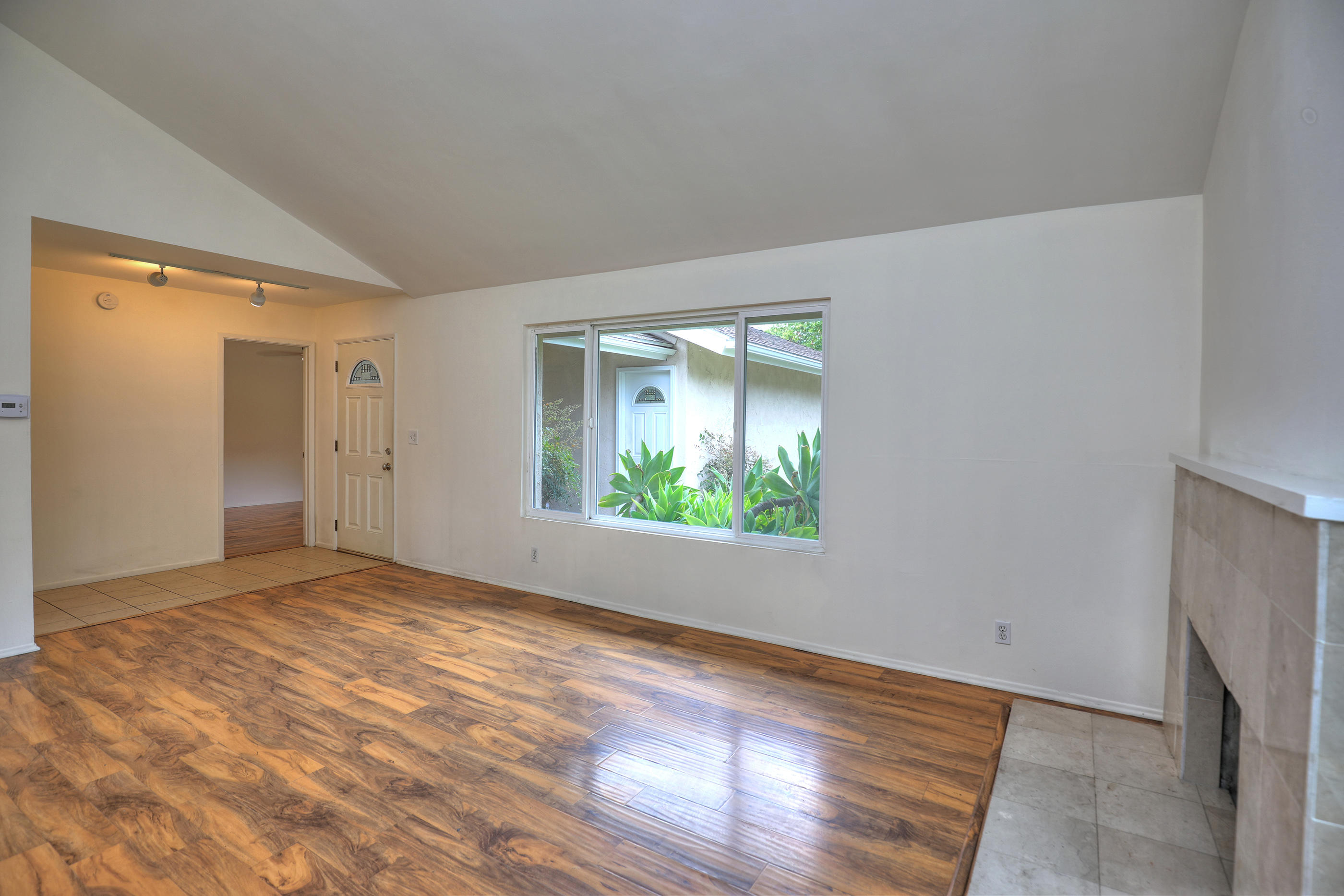 7320 Davenport Road Goleta, CA 93117 - Photo 4 of 18 a view of an empty room with wooden floor and a window