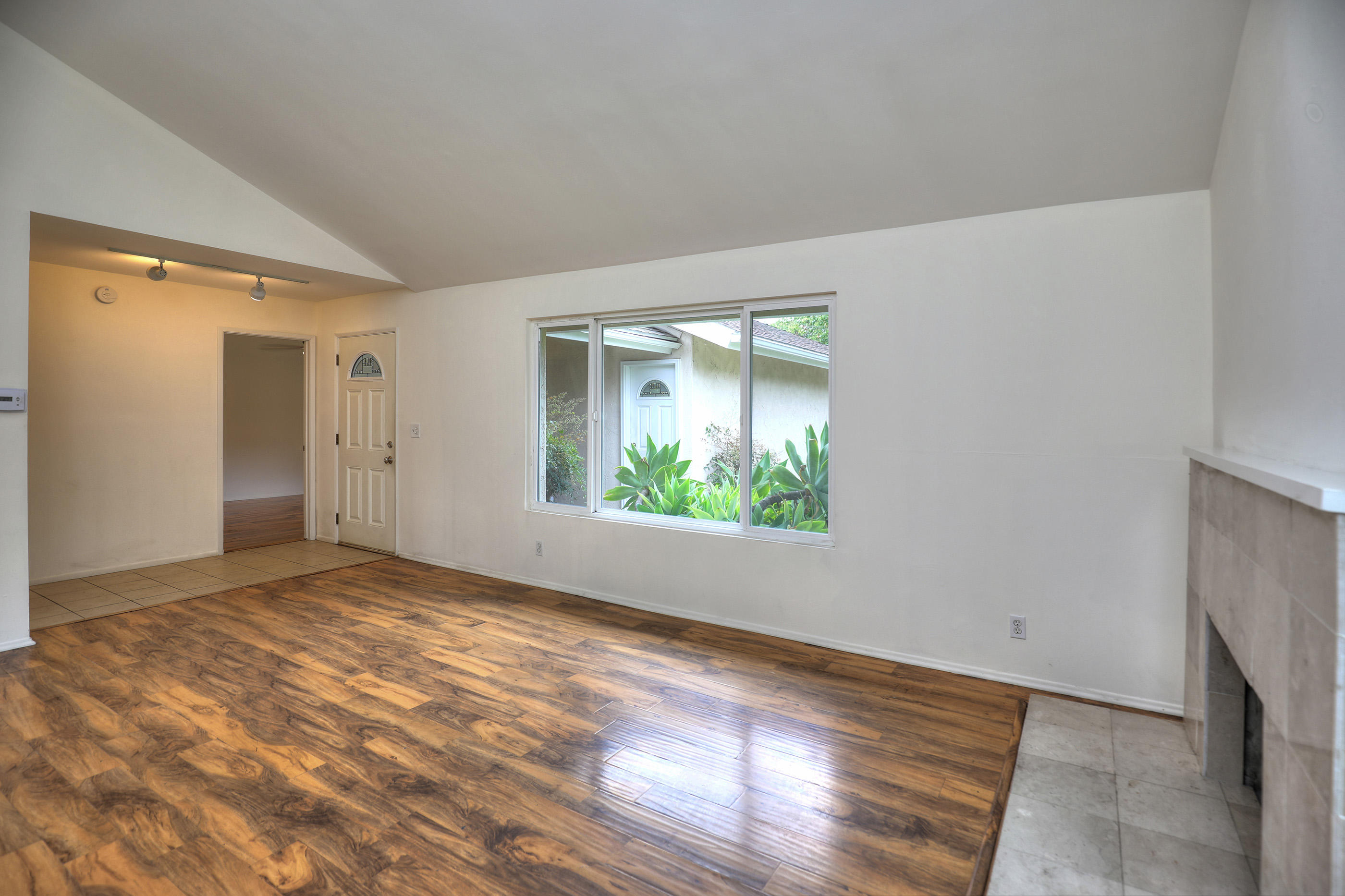 7320 Davenport Road Goleta, CA 93117 - Photo 5 of 18 a view of an empty room with wooden floor and a window