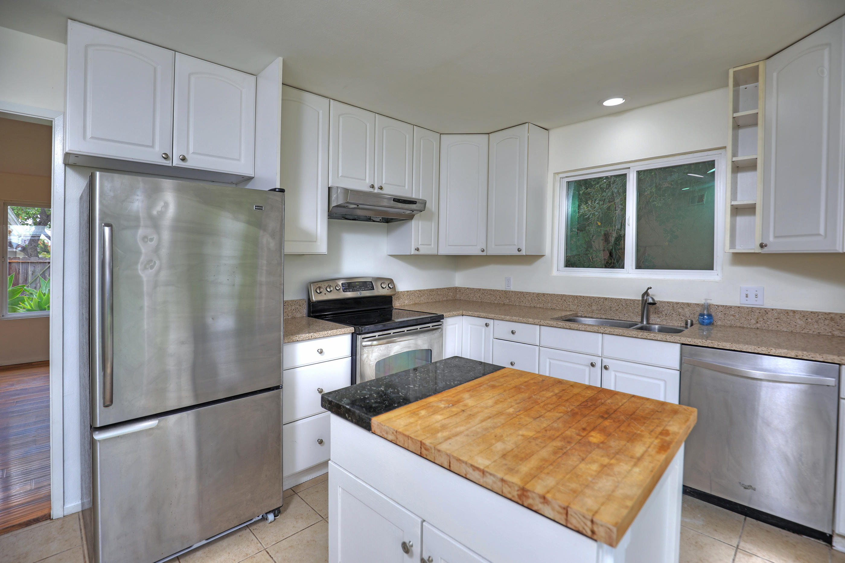 7320 Davenport Road Goleta, CA 93117 - Photo 7 of 18 a kitchen with stainless steel appliances granite countertop a refrigerator a stove a sink and a granite counter tops