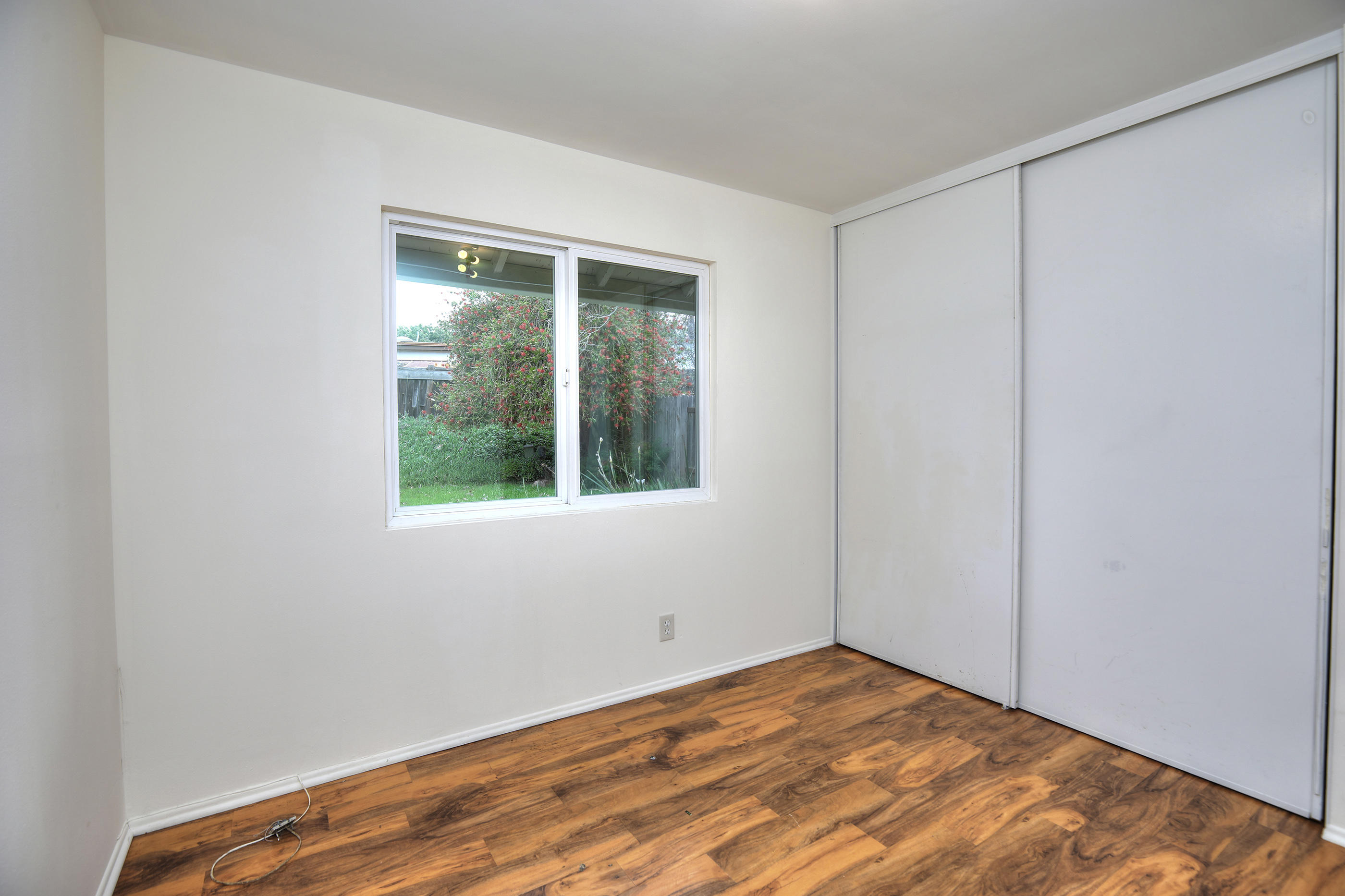 7320 Davenport Road Goleta, CA 93117 - Photo 10 of 18 a view of an empty room with wooden floor and a window