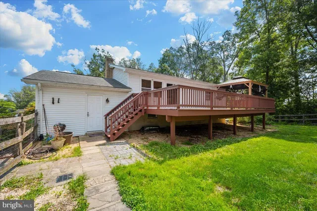 a view of a street with a big yard
