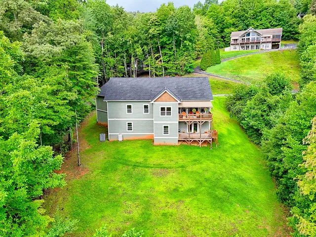 a living room with furniture fireplace and flat screen tv