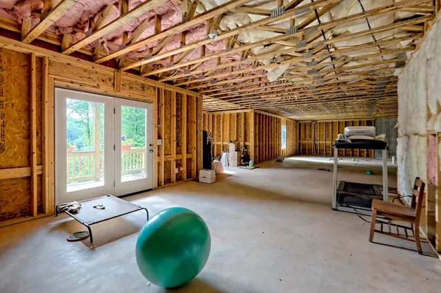 a bedroom with a bed and cabinets