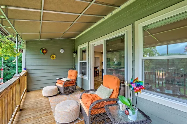 a en suite bathroom with a granite countertop sink a mirror and a shower