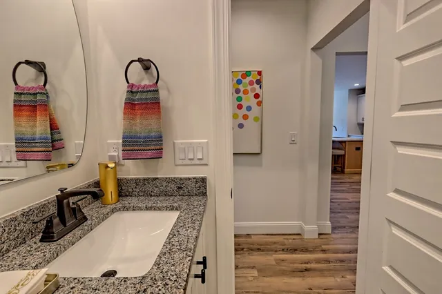 a kitchen with sink a refrigerator and cabinets