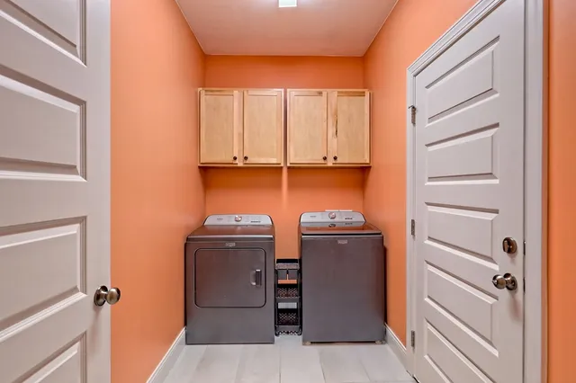 a white house with a small yard and a small yard