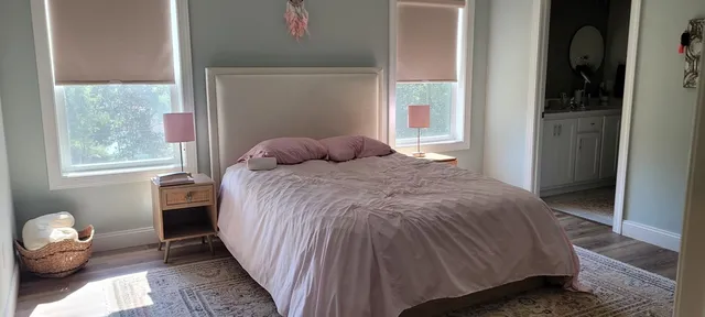 a view of a lake with a yard swimming pool and outdoor seating