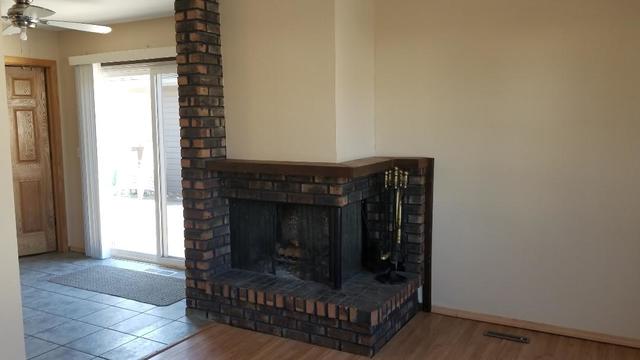 133 Heathgate Road Montgomery, IL 60538 - Photo 16 of 34 a living room with furniture and a fireplace