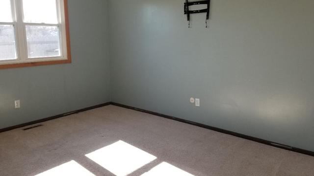 133 Heathgate Road Montgomery, IL 60538 - Photo 31 of 34 a view of an empty room and a window