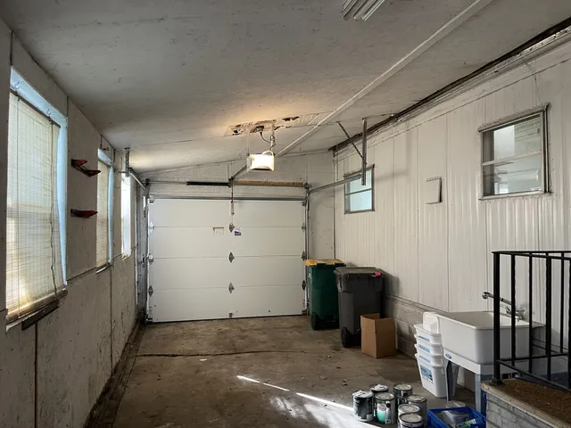 a view of entryway and hall with a chair