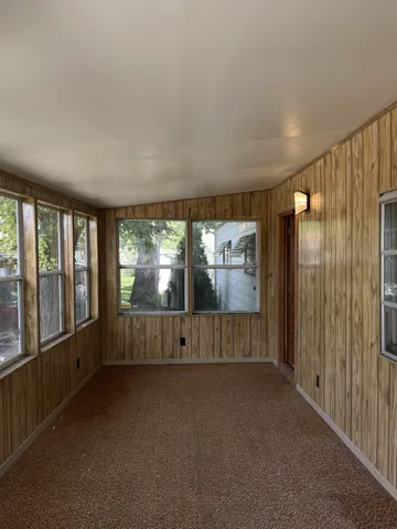 a view of an empty room with a window