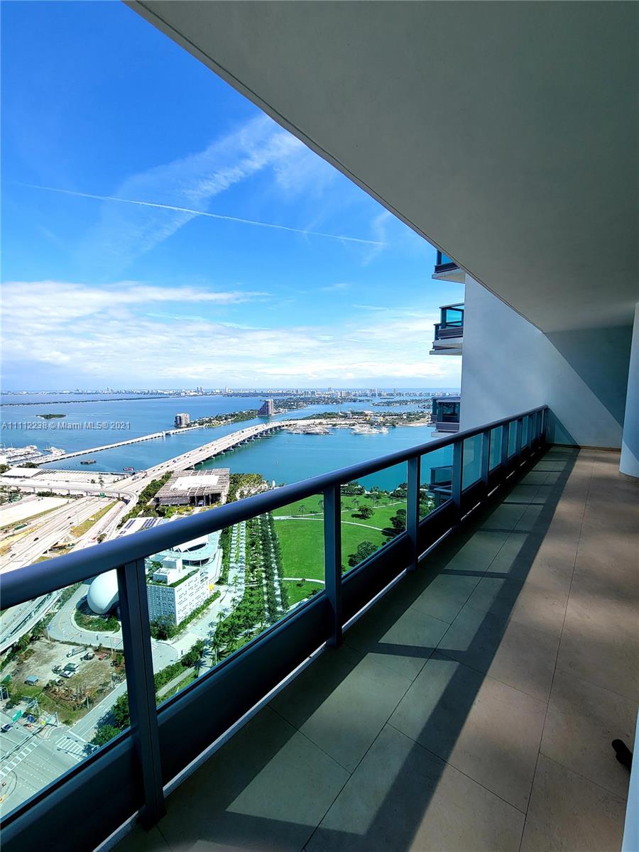 a view of swimming pool from a balcony