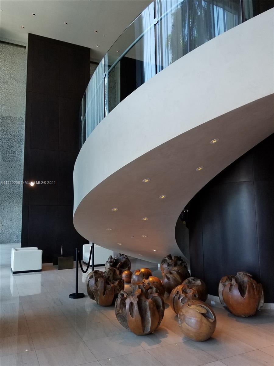 900 Biscayne Boulevard, Unit 4708 Miami, FL 33132 - Photo 15 of 21 a living room with furniture