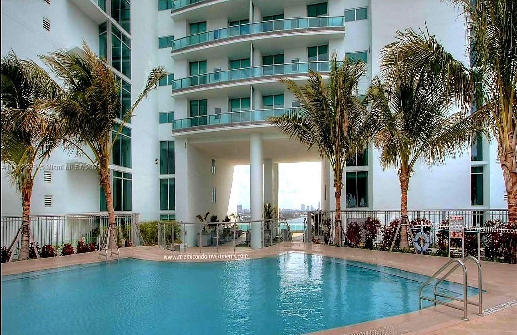 900 Biscayne Boulevard, Unit 4708 Miami, FL 33132 - Photo 19 of 21 a house with palm tree in front of it