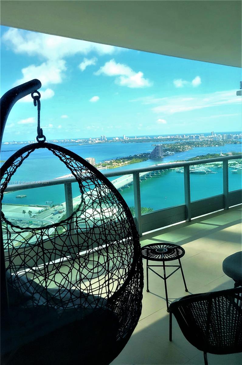 900 Biscayne Boulevard, Unit 4708 Miami, FL 33132 - Photo 5 of 21 a view of a swimming pool with a yard from a seating space