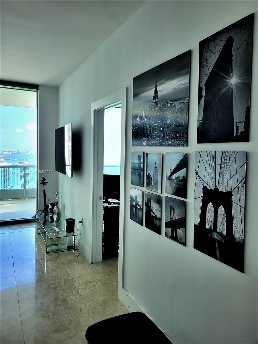 900 Biscayne Boulevard, Unit 4708 Miami, FL 33132 - Photo 6 of 21 a living room with furniture and a flat screen tv