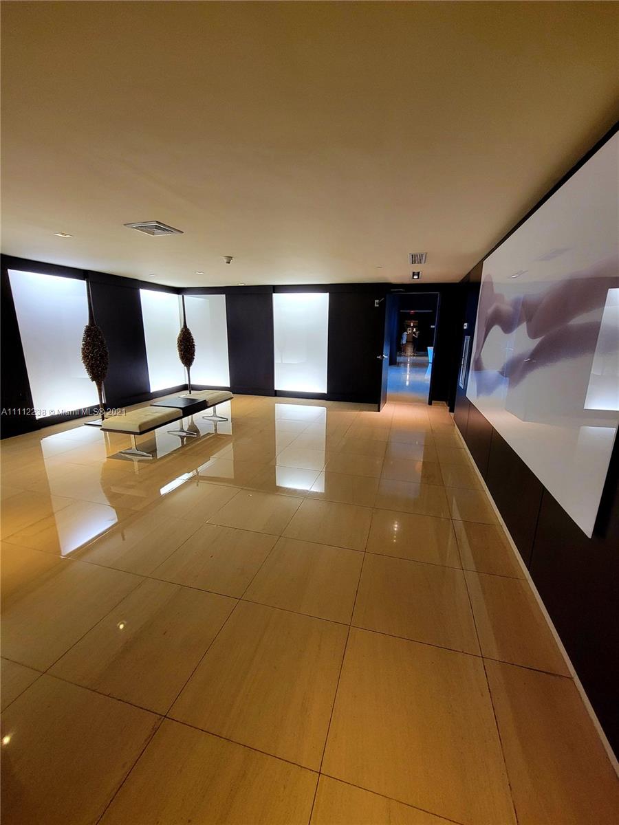 900 Biscayne Boulevard, Unit 4708 Miami, FL 33132 - Photo 8 of 21 a view of an empty room with windows