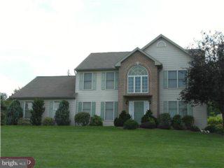 3014 Regency Drive Sinking Spring, PA 19608 - Photo 1 of 6 a front view of a house with a garden