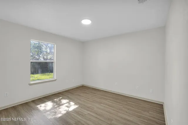 a view of an empty room and window