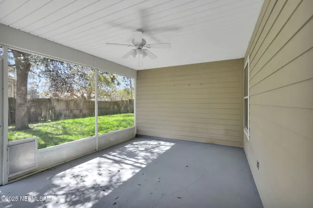 a view of a room with a large window