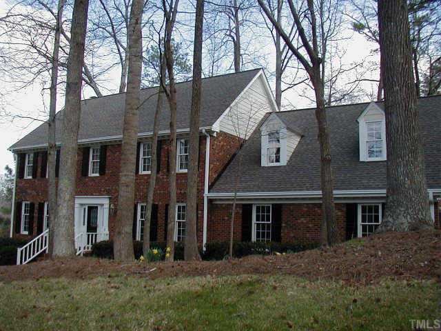 6924 Valley Ridge Court Raleigh, NC 27615 - Photo 1 of 1 a view of a brick house with a large windows and a large tree