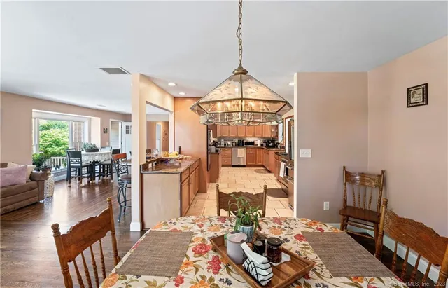 a living room with lots of furniture and a chandelier