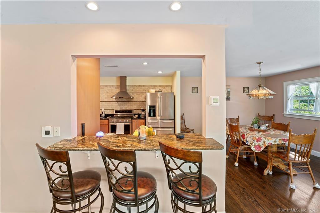 23 Sunset Hill Road Brookfield, CT 06804 - Photo 15 of 40 a dining room with a table and chairs
