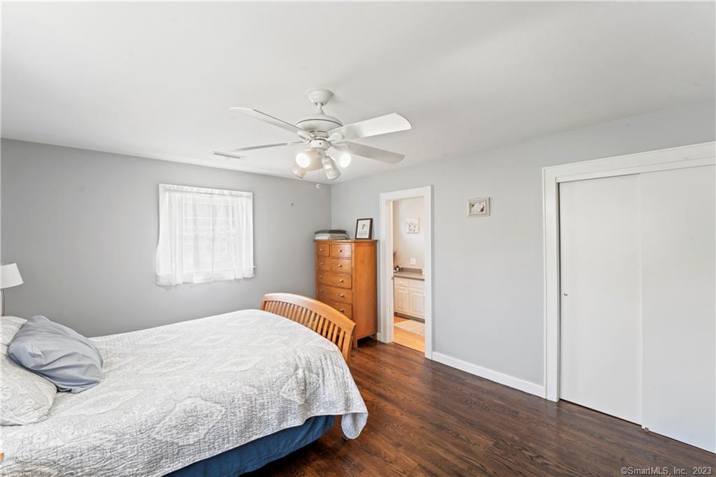 23 Sunset Hill Road Brookfield, CT 06804 - Photo 20 of 40 a bedroom with a bed and wooden floor