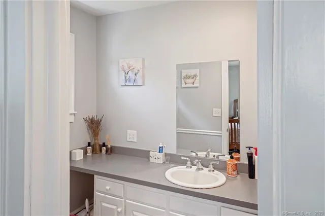a bathroom with a sink and a mirror