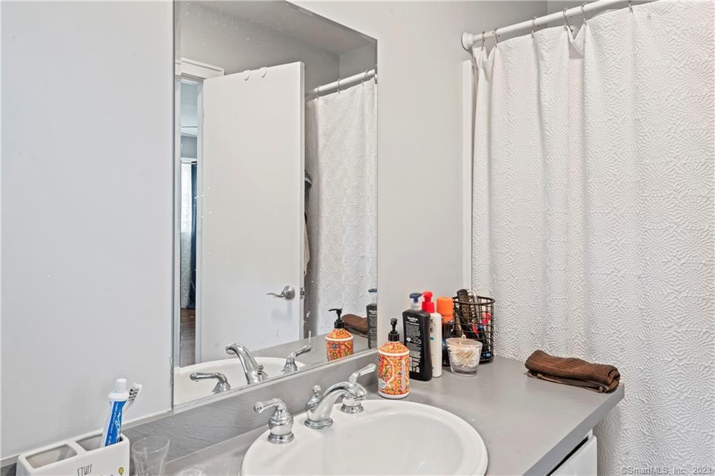 23 Sunset Hill Road Brookfield, CT 06804 - Photo 24 of 40 a bathroom with a sink and a mirror