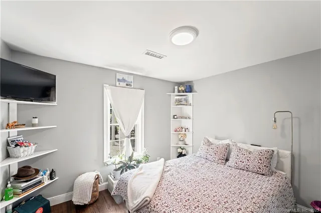 a bedroom with a bed and a closet