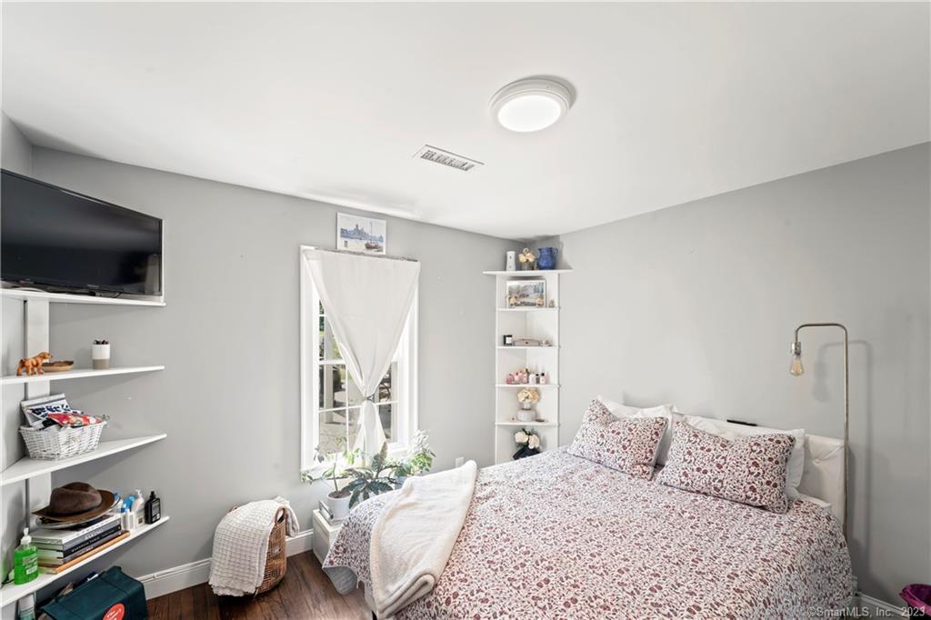 23 Sunset Hill Road Brookfield, CT 06804 - Photo 25 of 40 a bedroom with a bed and a flat screen tv