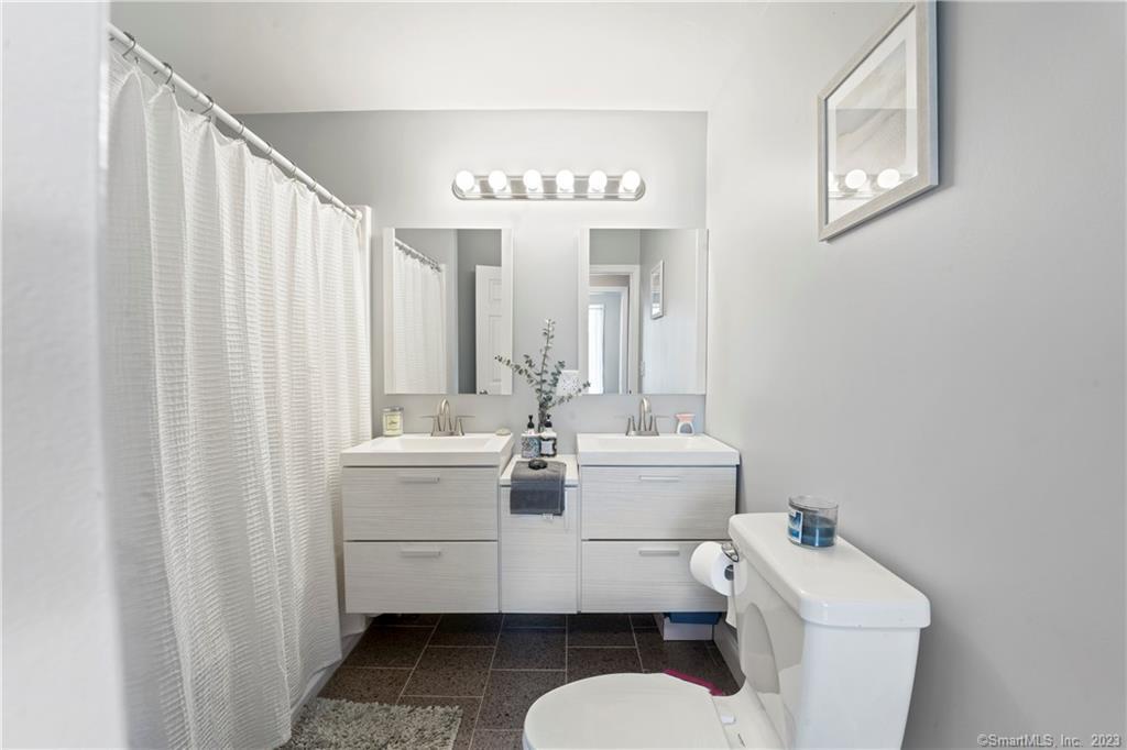 23 Sunset Hill Road Brookfield, CT 06804 - Photo 27 of 40 a bathroom with a sink mirror vanity and toilet
