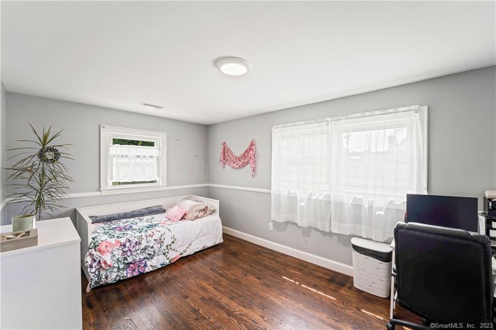 23 Sunset Hill Road Brookfield, CT 06804 - Photo 28 of 40 a bedroom with a bed and wooden floor