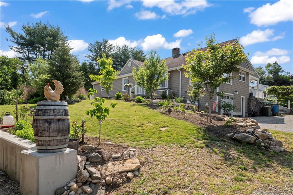 23 Sunset Hill Road Brookfield, CT 06804 - Photo 30 of 40 a view of a garden with a fountain