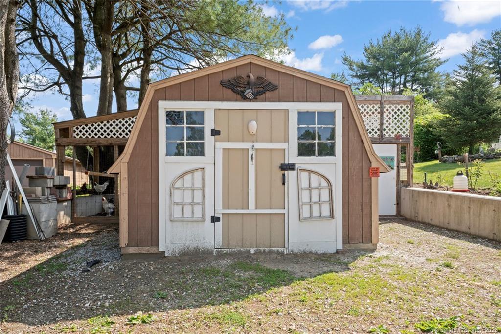 23 Sunset Hill Road Brookfield, CT 06804 - Photo 34 of 40 a front view of a house with a yard