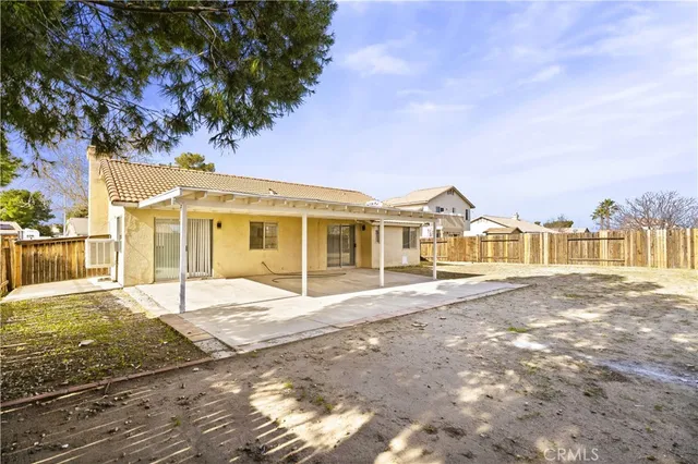 a view of a large house with a garden and pathway