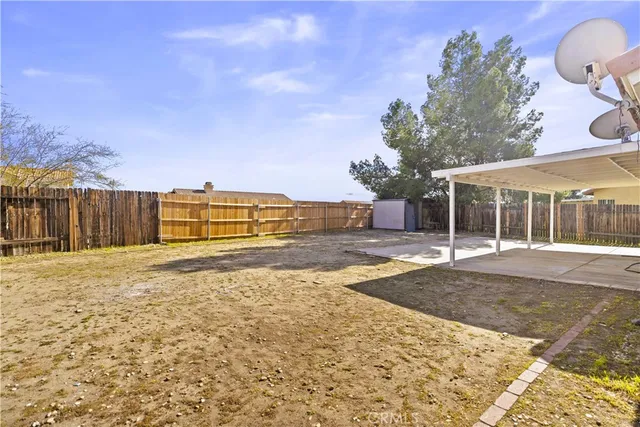 a view of a house with a yard and garage