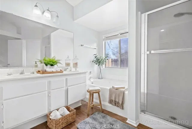 a bathroom with a double vanity sink and a mirror