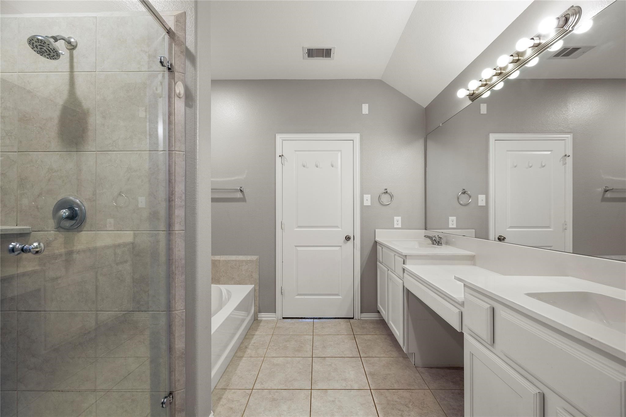 29507 Whitebrush Trace Drive Spring, TX 77386 - Photo 15 of 32 Primary bathroom with dual vanity, shower, and tile flooring.